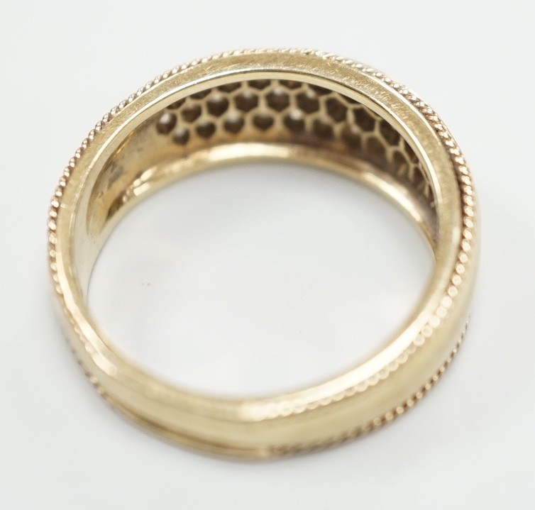A modern 9ct gold and pave diamond chip set ring, size M/N, gross weight 4.5 grams.